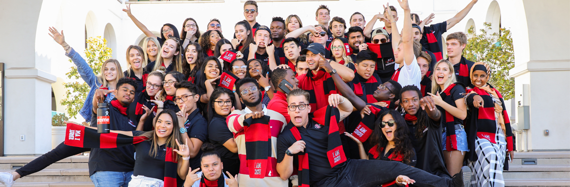 SDSU students wearing I AM SDSU scarves